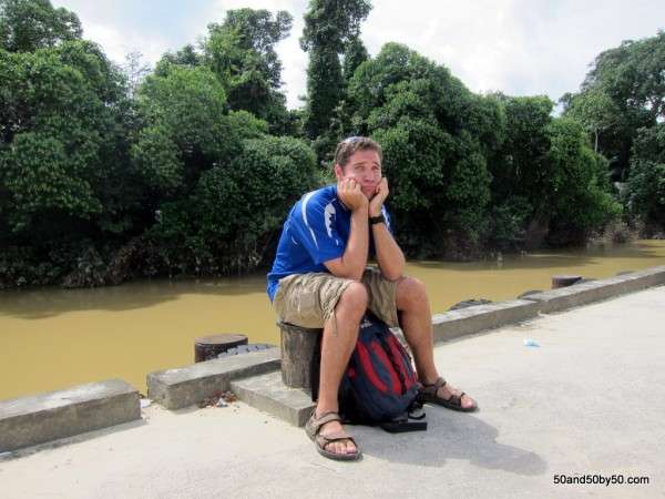 Niah me sitting on the curb waiting for the bus. Borneo travel fail - a 5 hour bus ride to find out it's closed