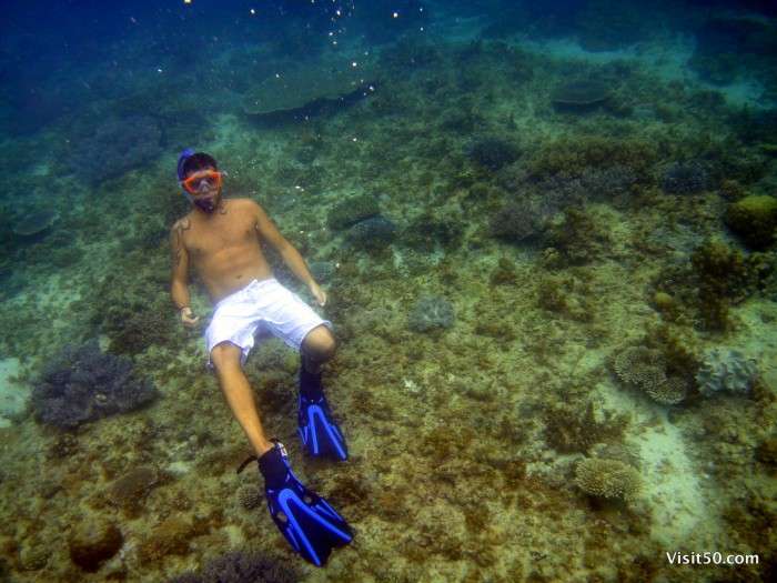 Philippines snorkeling - Giuseppe playing at the bottom of the sea - Visit50.com snorkeling photo in clear waters of Malapascua, Philippines